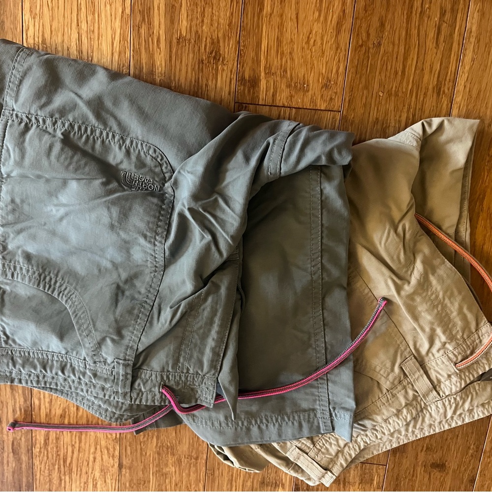 Two pair The North Face Greenish Gray and Tan pants. Size 12. Good condition.